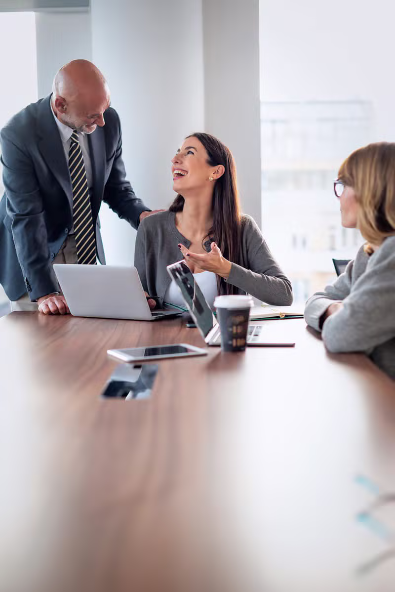 Corporate team collaborating in a modern boardroom